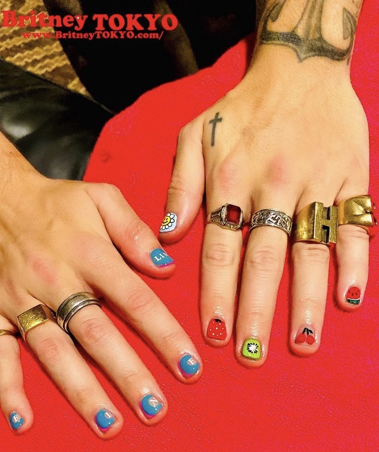 Harry Styles with mixed fruit nail art